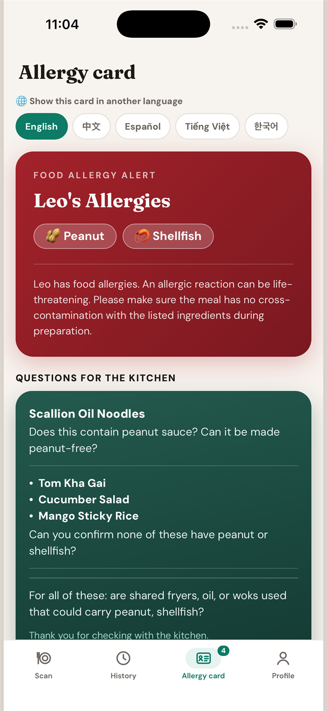 The allergy card with the kitchen questions collected below it, ready to show the server